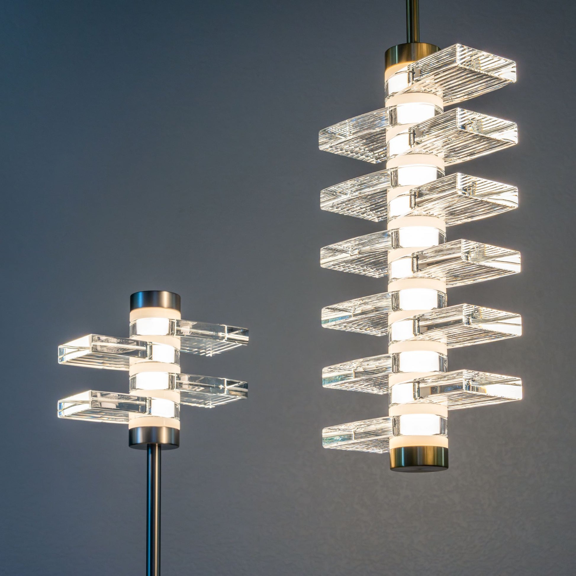 Table Lamp 04: Brushed Nickel, Clear. Chandelier 12: Brushed Brass, Grooved.